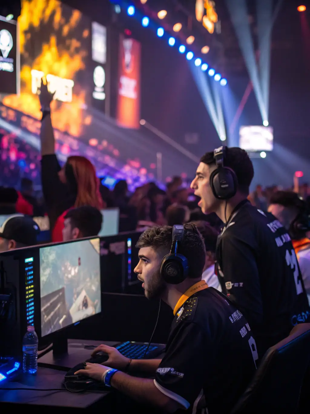 A vibrant scene from a local esports tournament organized by ESPORT AGORA, showcasing players competing intensely while a supportive crowd cheers them on.