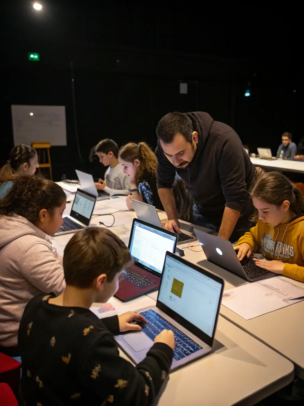 A collaborative session where ESPORT AGORA staff are mentoring young individuals, guiding them through the basics of digital literacy and responsible gaming habits.